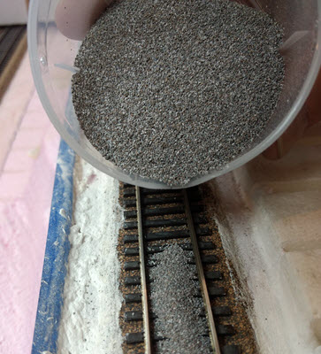 [ballast between rails]